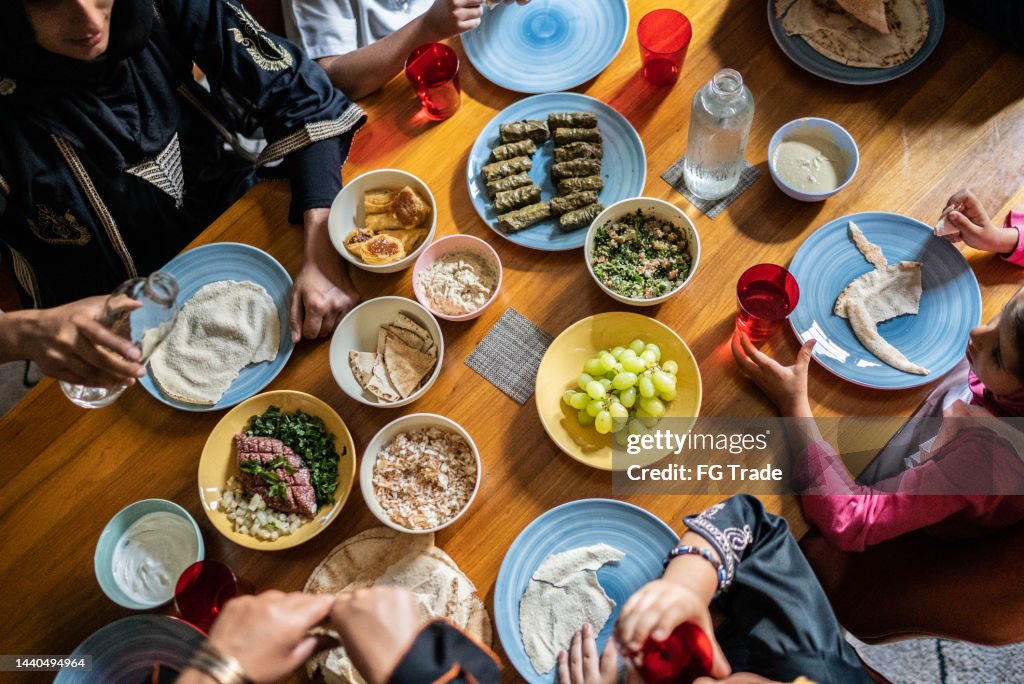 High angle view of a islamic family having lunch together at home
