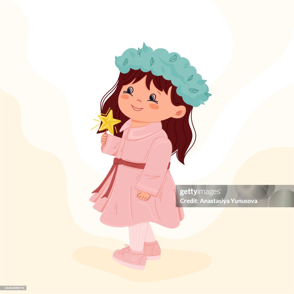Cute little girl wearing green wreath and holding shining star