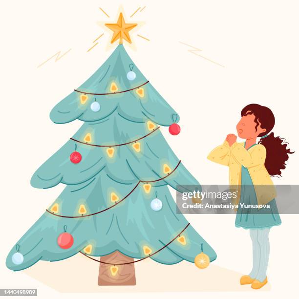 little girl is excited by bright christmas tree - christmas sweater stock illustrations