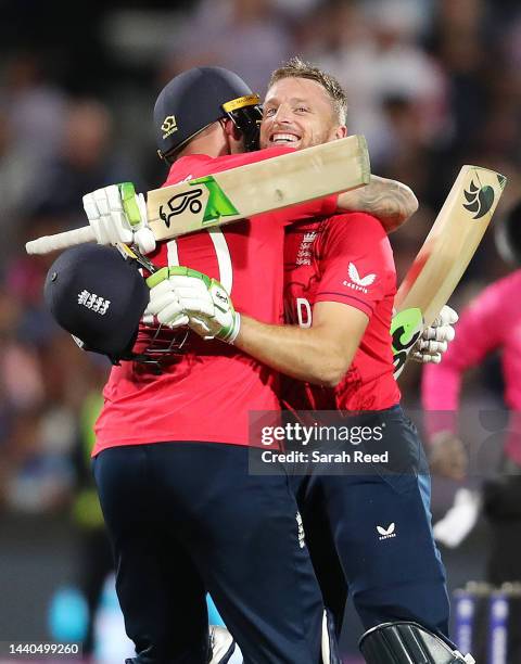 Alex Hales of England and Jos Buttler of England embrace as England wins the match during the ICC Men's T20 World Cup Semi Final match between India...