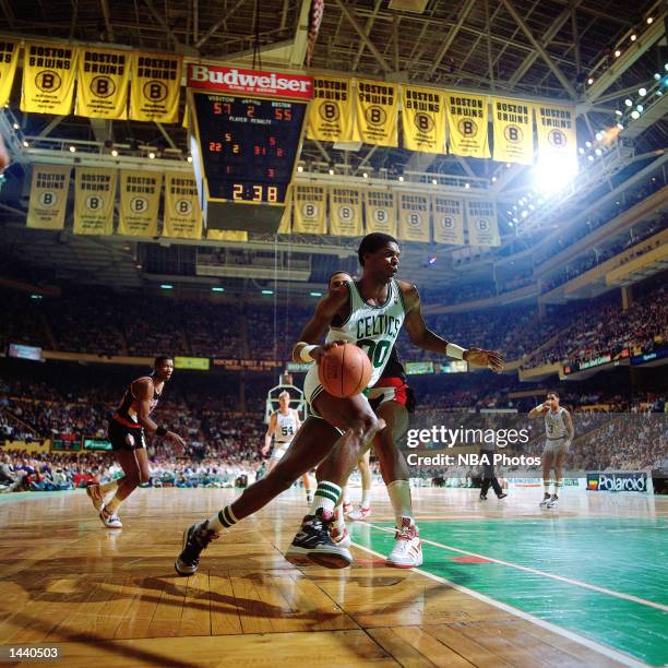 Robert Parish of the Boston Celtics drives to the basket against the Portland Trail Blazers during the NBA game at The Boston Garden in Boston, MA....