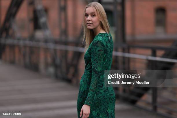 Lil Paulin seen wearing a green patterned long dress on November 08, 2022 in Hamburg, Germany.