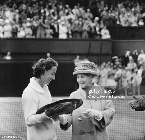 British tennis player Angela Mortimer receiving the winner's plate from Princess Alice after winning the women's singles final at the Wimbledon...
