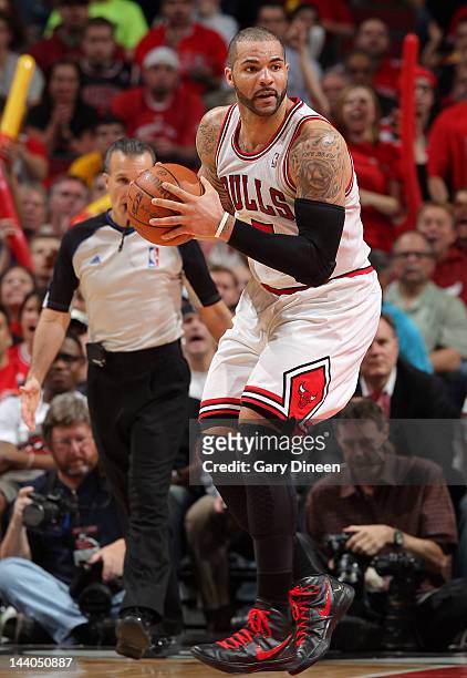Carlos Boozer of the Chicago Bulls controls the ball in Game Five of the Eastern Conference Quarterfinals against the Philadelphia 76ers during the...