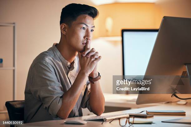 asian man, computer and worried at night, thinking and business planning with stress or overworked browse internet in office. male entrepreneur, digital device and anxious for idea, burnout and tired - wrong stock pictures, royalty-free photos & images