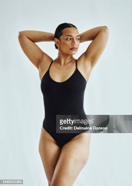 body positive, woman with curvy body in studio on a grey background. normal beauty and skincare with feminism and empowerment, feeling comfortable in skin and underwear - swimwear 個照片及圖片檔