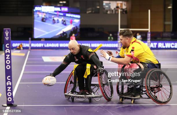 Scott Trigg-Turner of Wales goes over for a try during the Wheelchair Rugby League World Cup Group B match between Wales and Scotland at English...