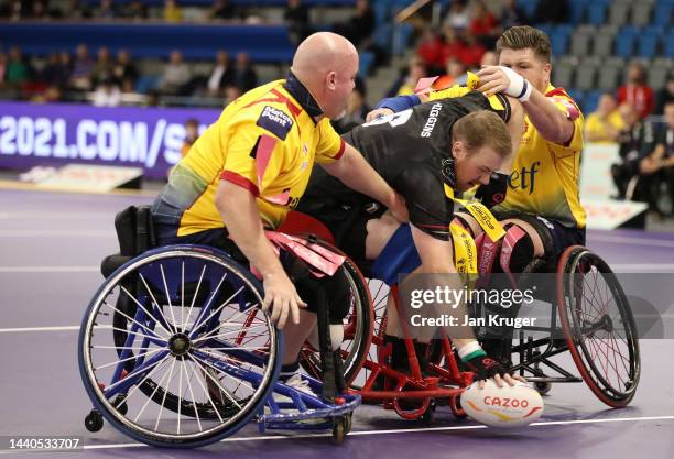 Andrew Higgins of Wales goes over for a try during the Wheelchair Rugby League World Cup Group B match between Wales and Scotland at English...