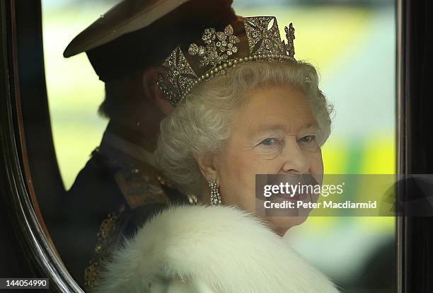 Queen Elizabeth II travels by coach to the State Opening of Parliament on May 9, 2012 in London, England. Queen Elizabeth II unveiled the coalition...