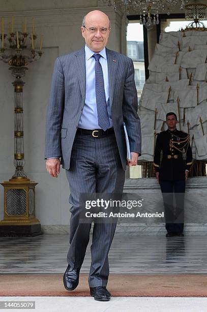 French Foreign Minister Alain Juppe leaves the weekly cabinet meeting at Elysee Palace on May 9, 2012 in Paris, France.