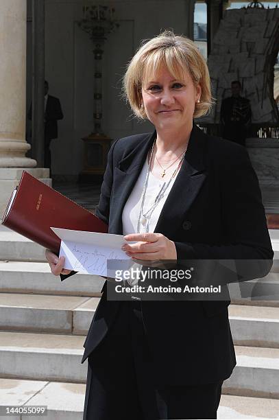 France's minister in charge of Apprenticeship and professional training Nadine Moranoe shows a present from French President Nicolas Sarkozy after...