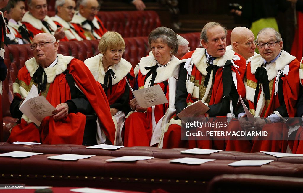 Members of the House of Lords sit in the