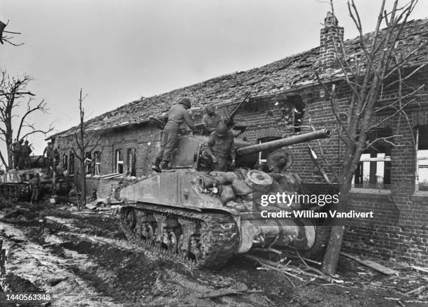 Tank crewman operate an M4A3W Sherman tank from the 761st 'Black Panthers' Tank Battalion attached to the 79th Infantry Division, United States...