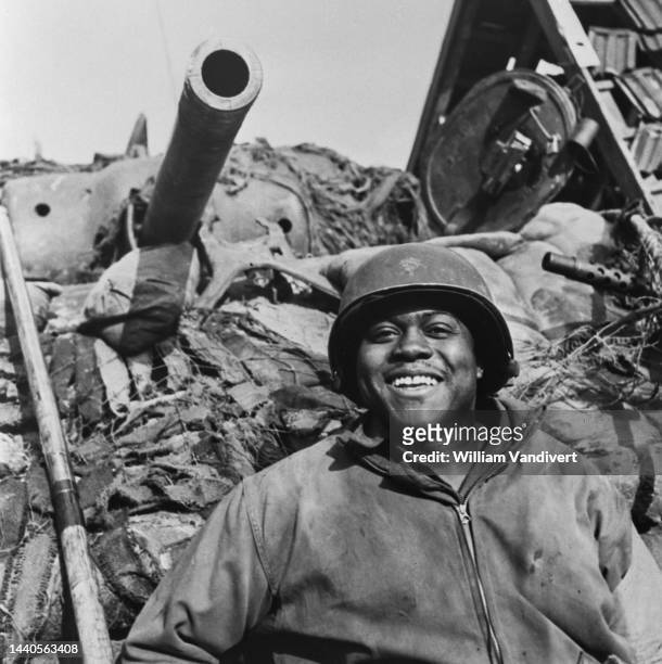 Technician fifth grade Willie Blow, tank driver of a M4A3W Sherman tank from the African American 784th Tank Battalion attached to the 35th Infantry...