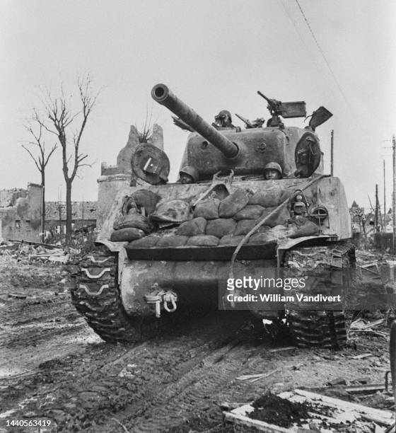 African American tank crews operating an M4A3W Sherman tank from the 761st 'Black Panthers Tank Battalion attached to the 79th Infantry Division,...