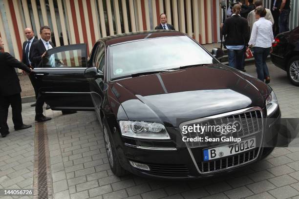 German Interior Minister Hans-Peter Friedrich gets into his government car after touring the expanded youth arrest facility in Lichtenrade district...