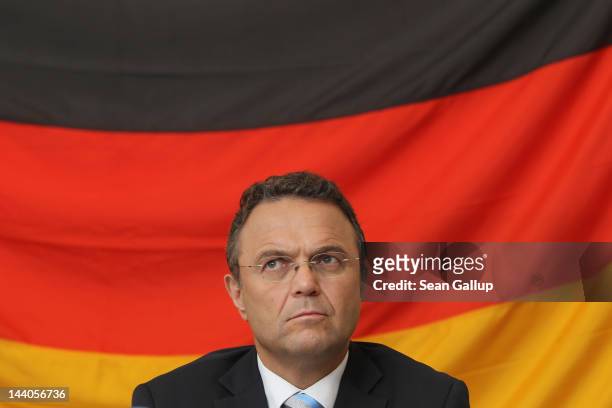 German Interior Minister Hans-Peter Friedrich speaks to the media after touring the expanded youth arrest facility in Lichtenrade district on May 9,...