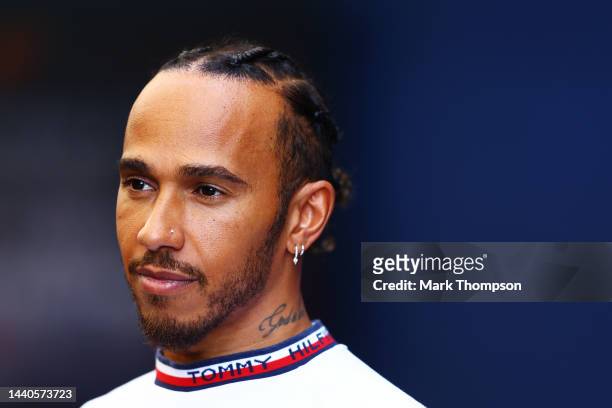 Lewis Hamilton of Great Britain and Mercedes looks on in the Paddock during previews ahead of the F1 Grand Prix of Brazil at Autodromo Jose Carlos...
