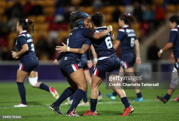 Elisa Ciria of France celebrates their sides second try with team mates during the Women's Rugby League World Cup Group B match between France Women...