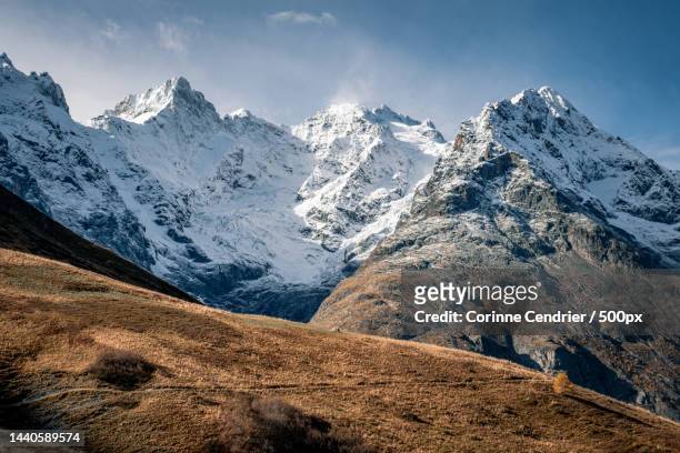 scenic view of snowcapped mountains against sky,col du lautaret,france - corinne paradis - fotografias e filmes do acervo