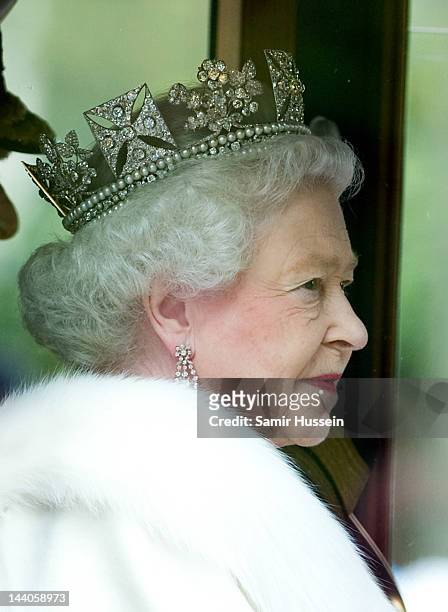 Queen Elizabeth II travels by coach to the State Opening of Parliament on May 9, 2012 in London, England.