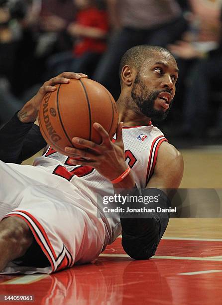 Watson of the Chicago Bulls looks to pass after hitting the floor against the Philadelphia 76ers in Game Five of the Eastern Conference Quarterfinals...