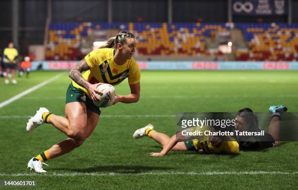 Julia Robinson of Australia crosses for their team's second try during the Women's Rugby League World Cup Group B match between Australia Women and...