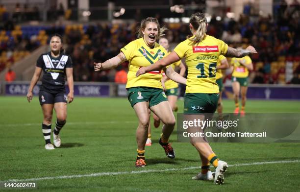 Caitlan Johnston of Australia celebrates with teammate Julia Robinson after they score their team's second try during the Women's Rugby League World...