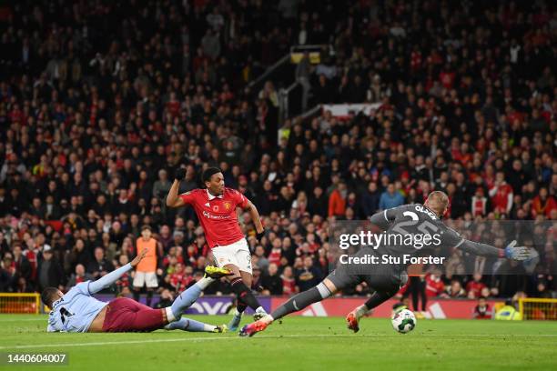 Anthony Martial of Manchester United scores their team's first goal past Robin Olsen of Aston Villa during the Carabao Cup Third Round match between...