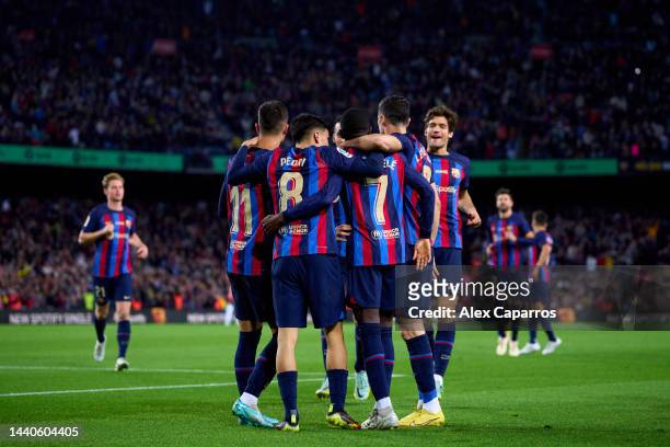 Ousmane Dembele of FC Barcelona celebrates with teammates after scoring their team's first goal during the LaLiga Santander match between FC...
