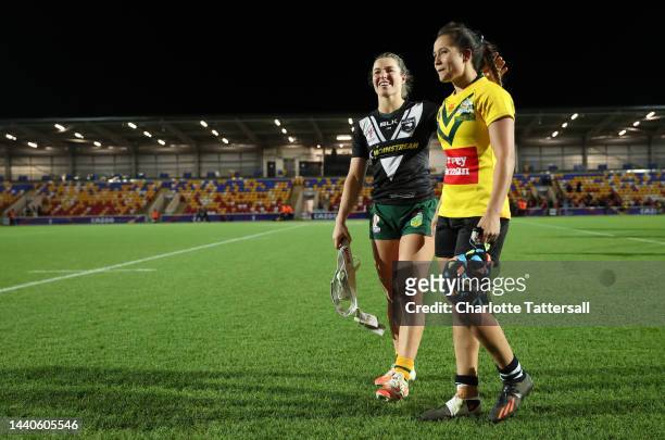 Emma Tonegato of Australia and Page McGregor of New Zealand interact following the Women's Rugby League World Cup Group B match between Australia...