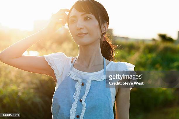 woman touching hair - west asian ethnicity stockfoto's en -beelden