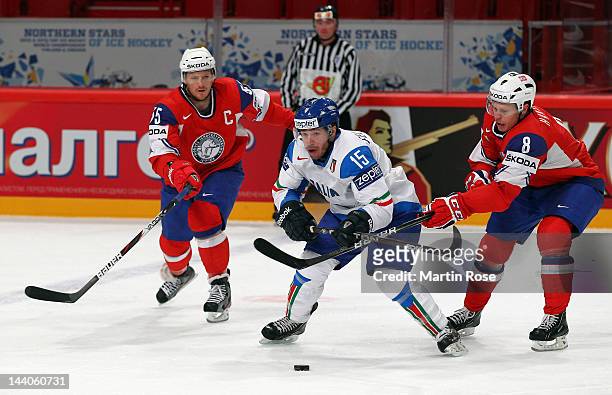Mads Hansen of Norway and Luca Felicetti of Italy battle for the puck during the IIHF World Championship group S match between Norway and Italy at...