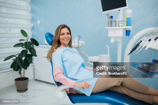 happy woman visiting a dentist office - patients brothers 個照片及圖片檔