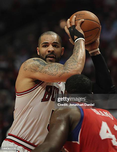 Carlos Boozer of the Chicago Bulls looks to pass against Elton Brand of the Philadelphia 76ers in Game Five of the Eastern Conference Quarterfinals...