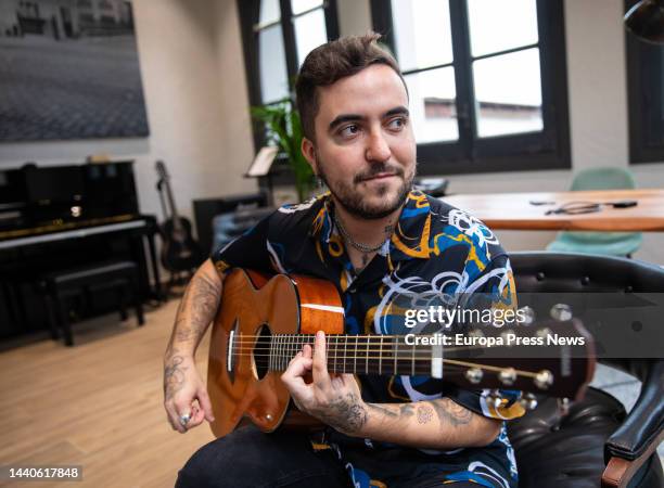 Singer Beret poses with his guitar during an interview for Europa Press, at Warner Music Spain, on November 8 in Madrid, Spain. During his interview,...