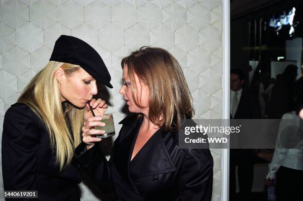 British fashion designer Stella McCartney sharing a mojito with American actress Gwyneth Paltrow at the opening of McCartney's new store.