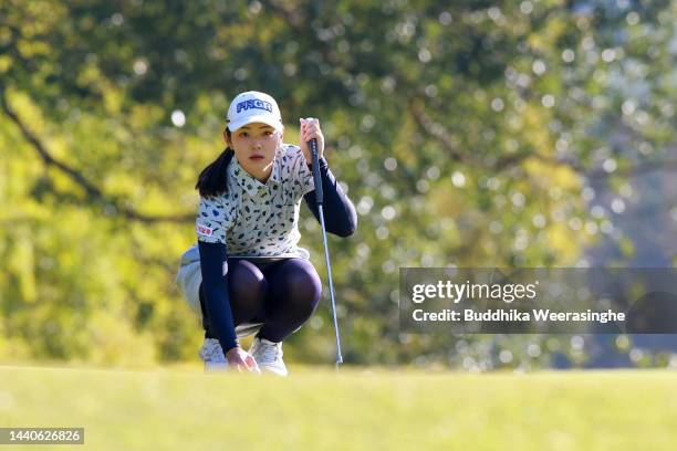 Rie Tsuji of Japan lines up a putt on the 1st green during the second round of the Yamaguchi Shunan Ladies Cup at Shunan Country Club on November 11,...