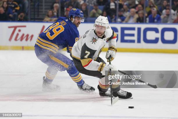 Alex Pietrangelo of the Vegas Golden Knights skates against Alex Tuch of the Buffalo Sabres during the first period of an NHL hockey game at KeyBank...