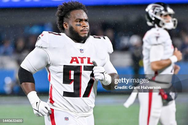 Grady Jarrett of the Atlanta Falcons jogs towards his sideline before his game against the Carolina Panthers at Bank of America Stadium on November...