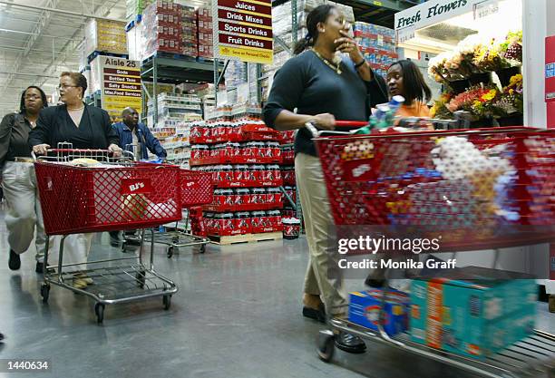 Claudia Noel shops at BJ's Warehouse October 1, 2002 at the Gateway Center in Brooklyn, New York during the grand opening of the strip mall offering...