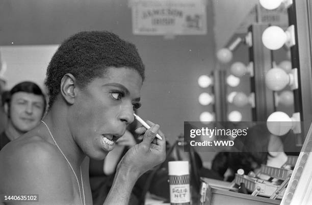 Drag performer Willi Smith prepares backstage at a fundraising party for the Alley Theater Guild in Houston, Texas