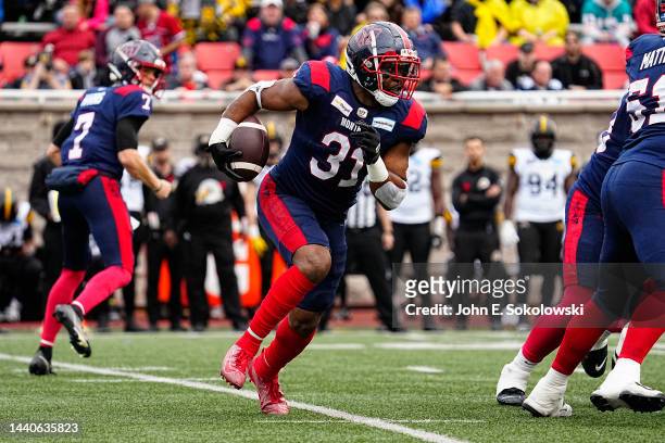 William Stanback of the Montreal Alouettes rushes the football against the Hamilton Tiger-Cats at Percival Molson Stadium on November 6, 2022 in...