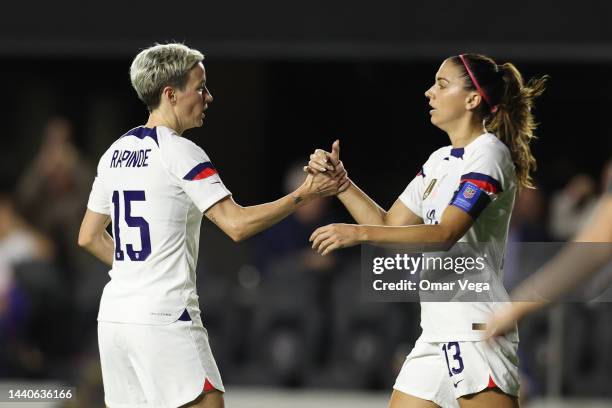 Megan Rapinoe of United States celebrates with her teammate Alex Morgan after scores first goal during the women's international friendly match...