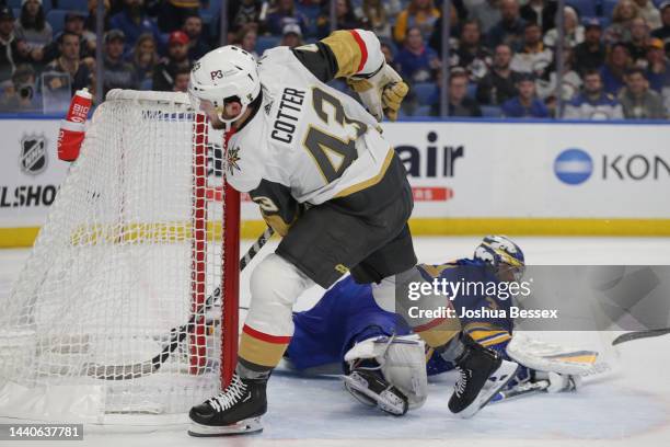 Paul Cotter of the Vegas Golden Knights scores a goal by Eric Comrie of the Buffalo Sabres during the second period of an NHL hockey game at KeyBank...
