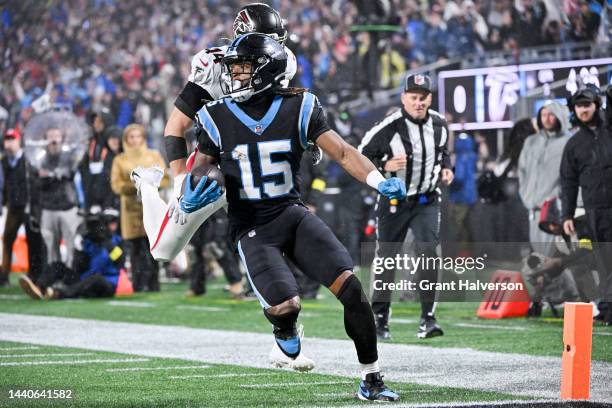 Laviska Shenault Jr. #15 of the Carolina Panthers runs past Troy Andersen of the Atlanta Falcons while scoring a touchdown during the second quarter...