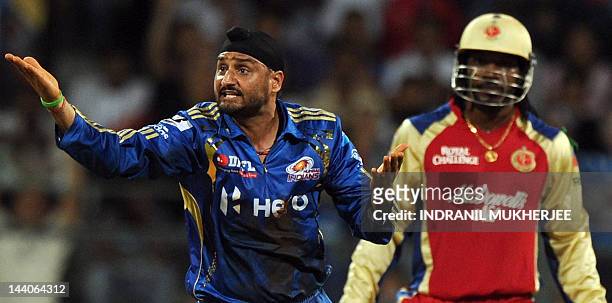 Mumbai Indians cricketer Harbhajan Singh appeals unsuccessfully against Royal Challengers Bangalore batsman Chris Gayle during the IPL Twenty20...