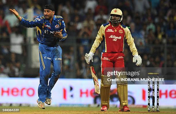 Mumbai Indians cricketer Harbhajan Singh appeals unsuccessfully against Royal Challengers Bangalore batsman Chris Gayle during the IPL Twenty20...