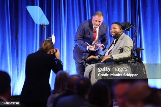 Greg Schiano and Eric LeGrand speak ontage during the Christopher & Dana Reeve Foundation Gala, A Magical Evening 2022 at Cipriani South Street on...
