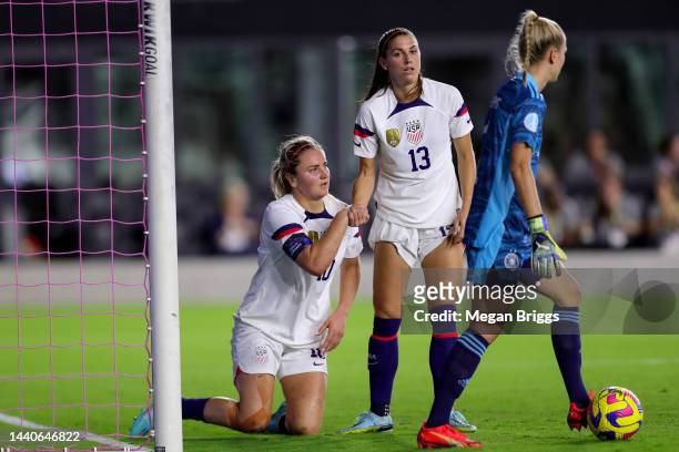 Alex Morgan of the United States helps up teammate Lindsey Horan after missing a goal against Germany during the first half in the women's...